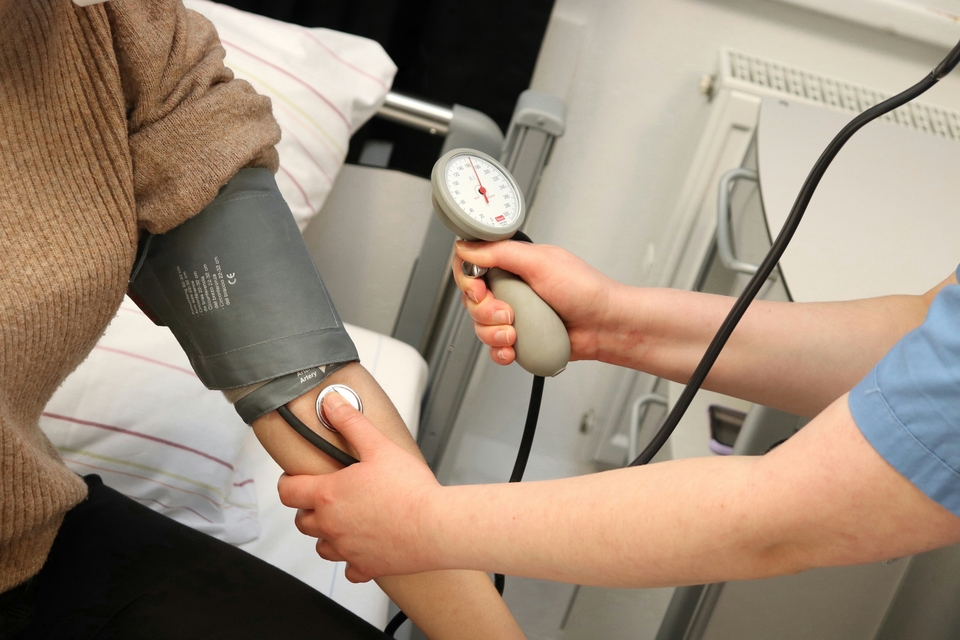 Nurse taking a patient's blood pressure