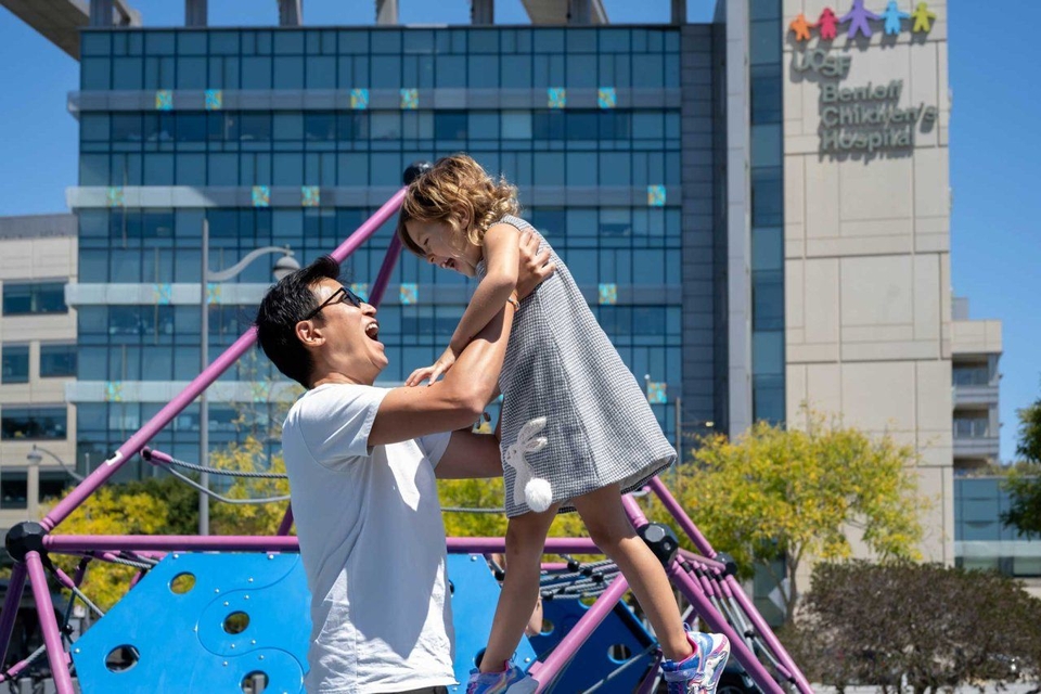 Father and daughter outside of UCSF Benioff Children's Hospital