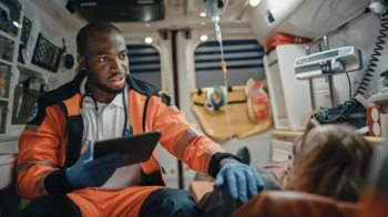 EMS professional with child in ambulance