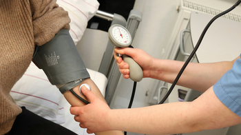 Nurse taking a patient's blood pressure