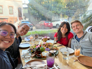 four people at a dinner table