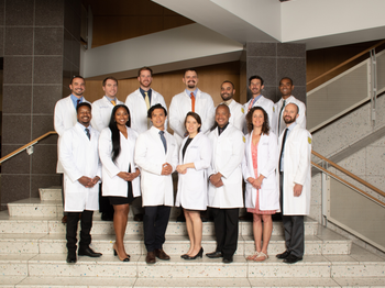 All the graduates of class 2019 posing for a group photo on stairs