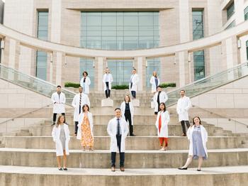 Class of 2024 posing for a photo on stairs