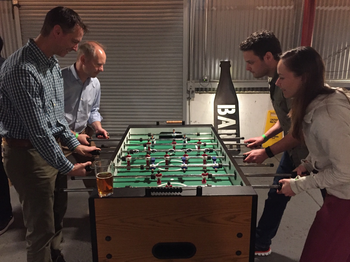 four people playing fusbal